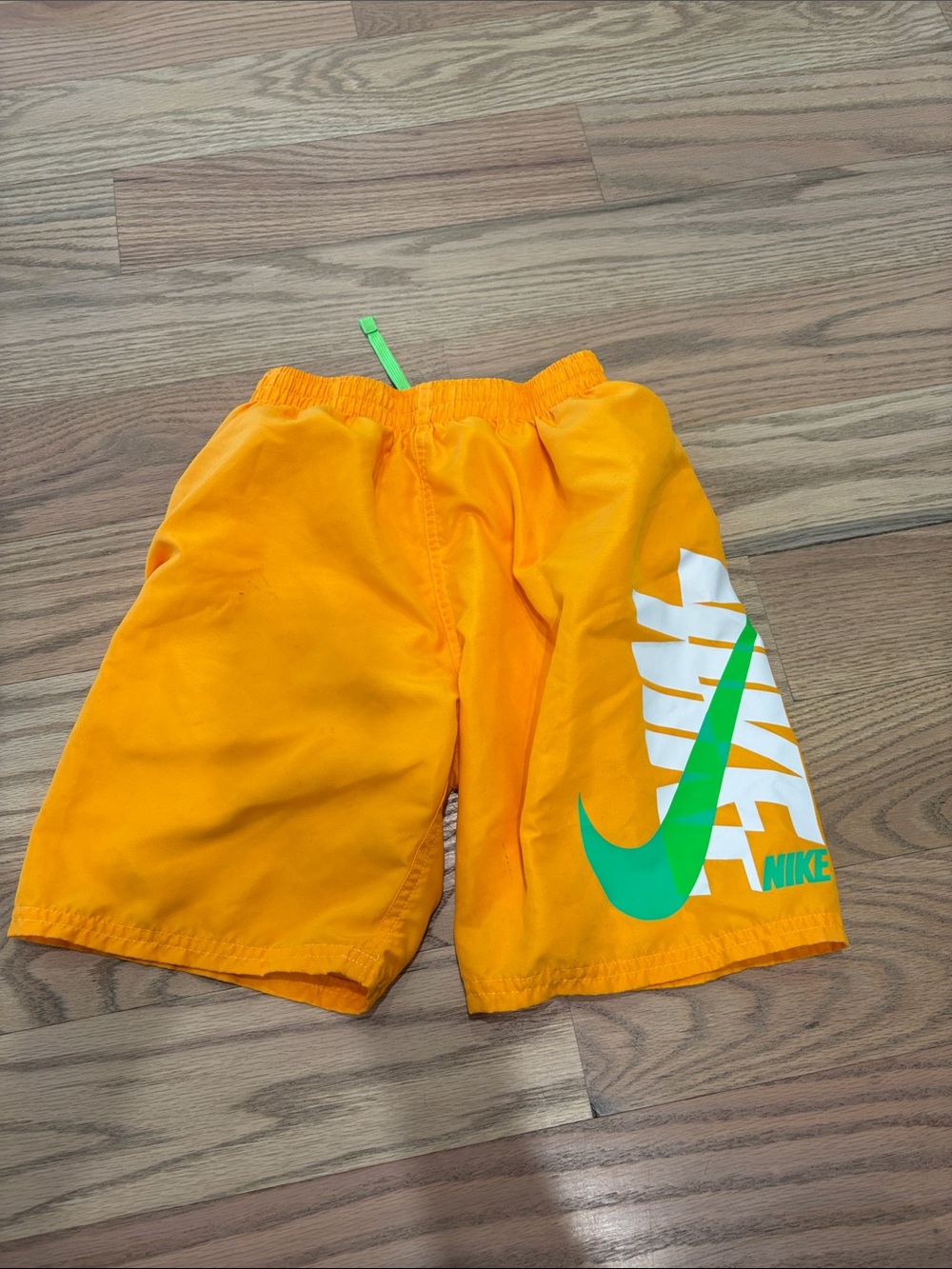 Nike Bright Orange Kids swimsuit with Green Swoosh